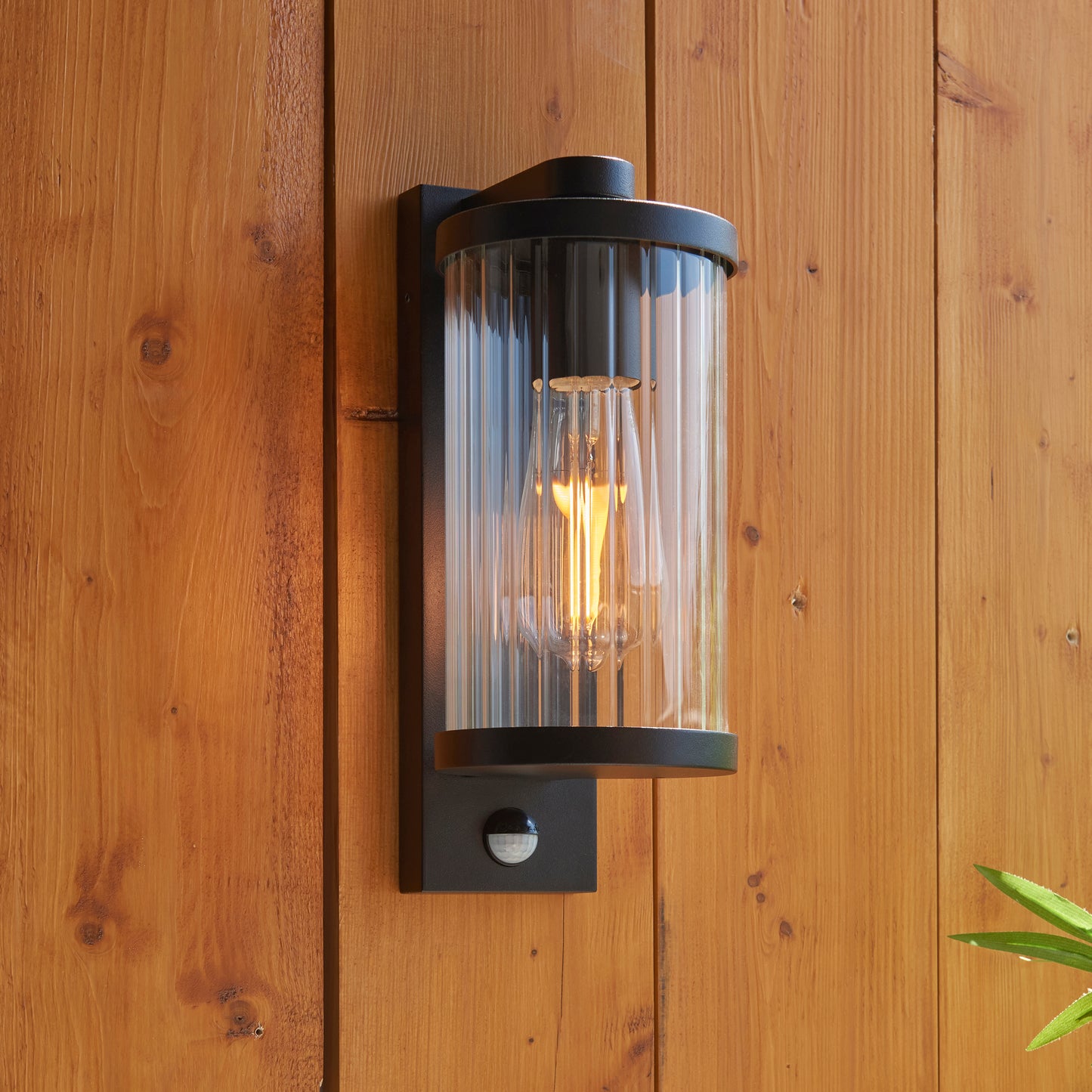 Outdoor Wall Light with Integrated PIR in Black with Ribbed Glass - ID 13968