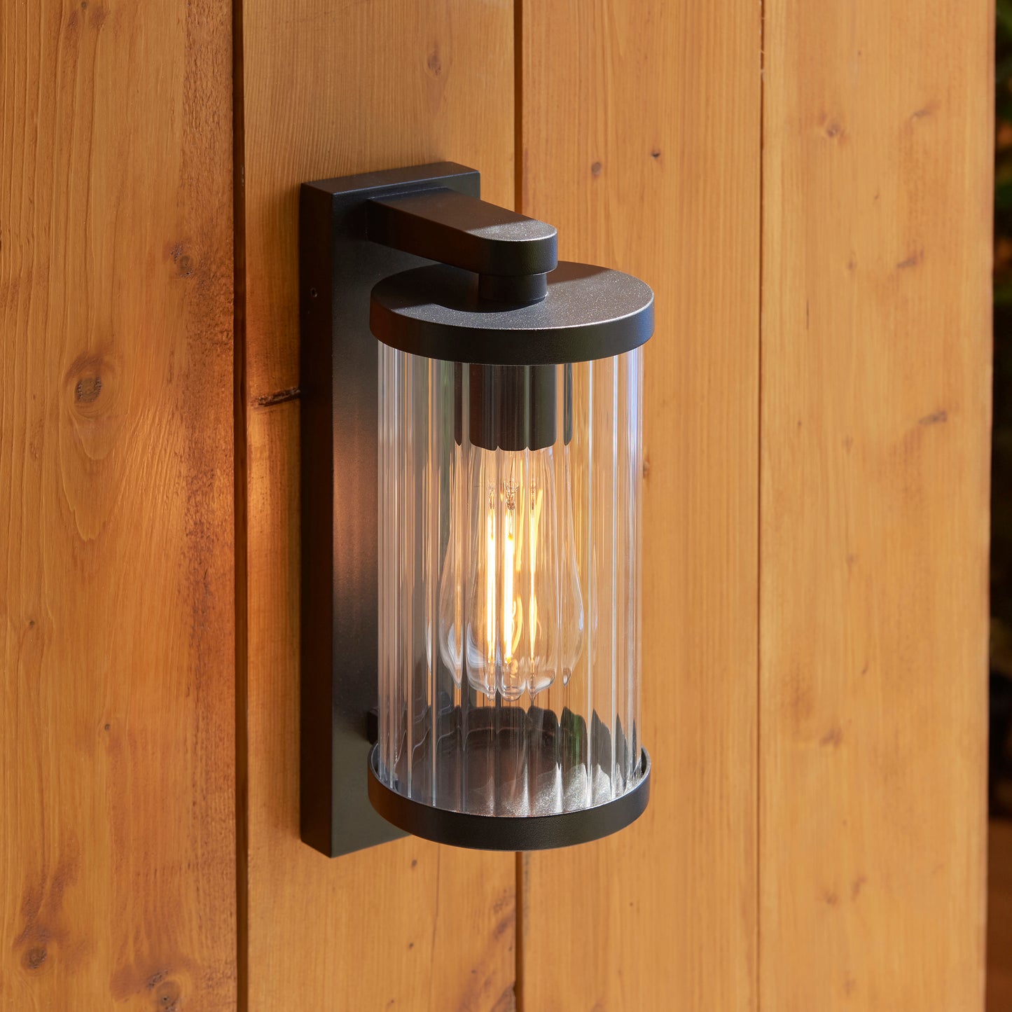 Outdoor Wall Light with Integrated PIR in Black with Ribbed Glass - ID 13968