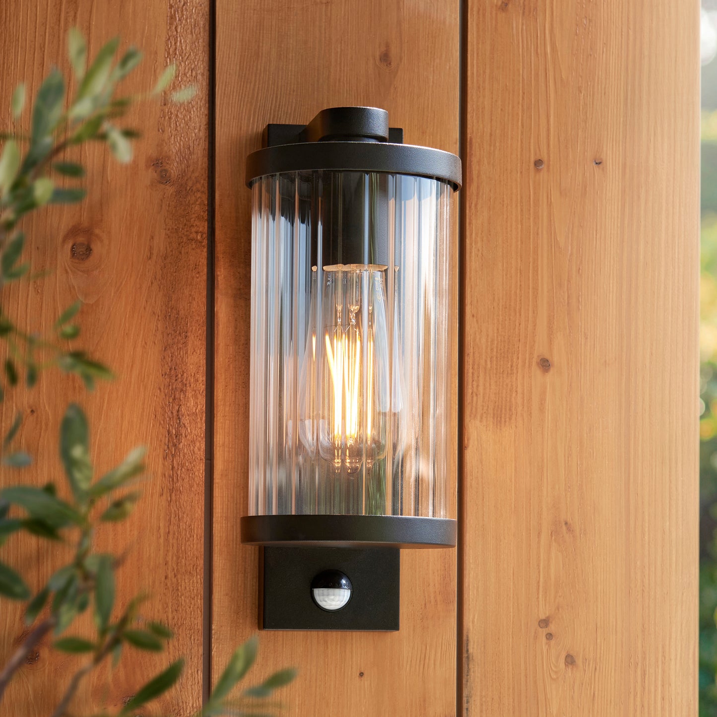 Outdoor Wall Light with Integrated PIR in Black with Ribbed Glass - ID 13968