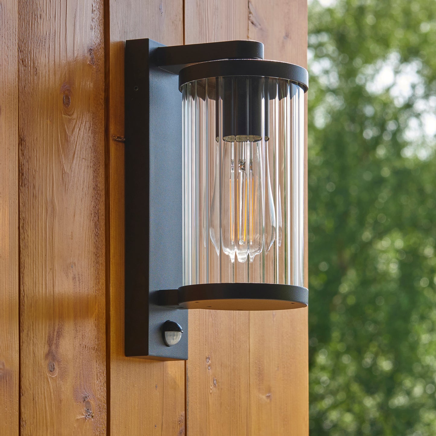 Outdoor Wall Light with Integrated PIR in Black with Ribbed Glass - ID 13968