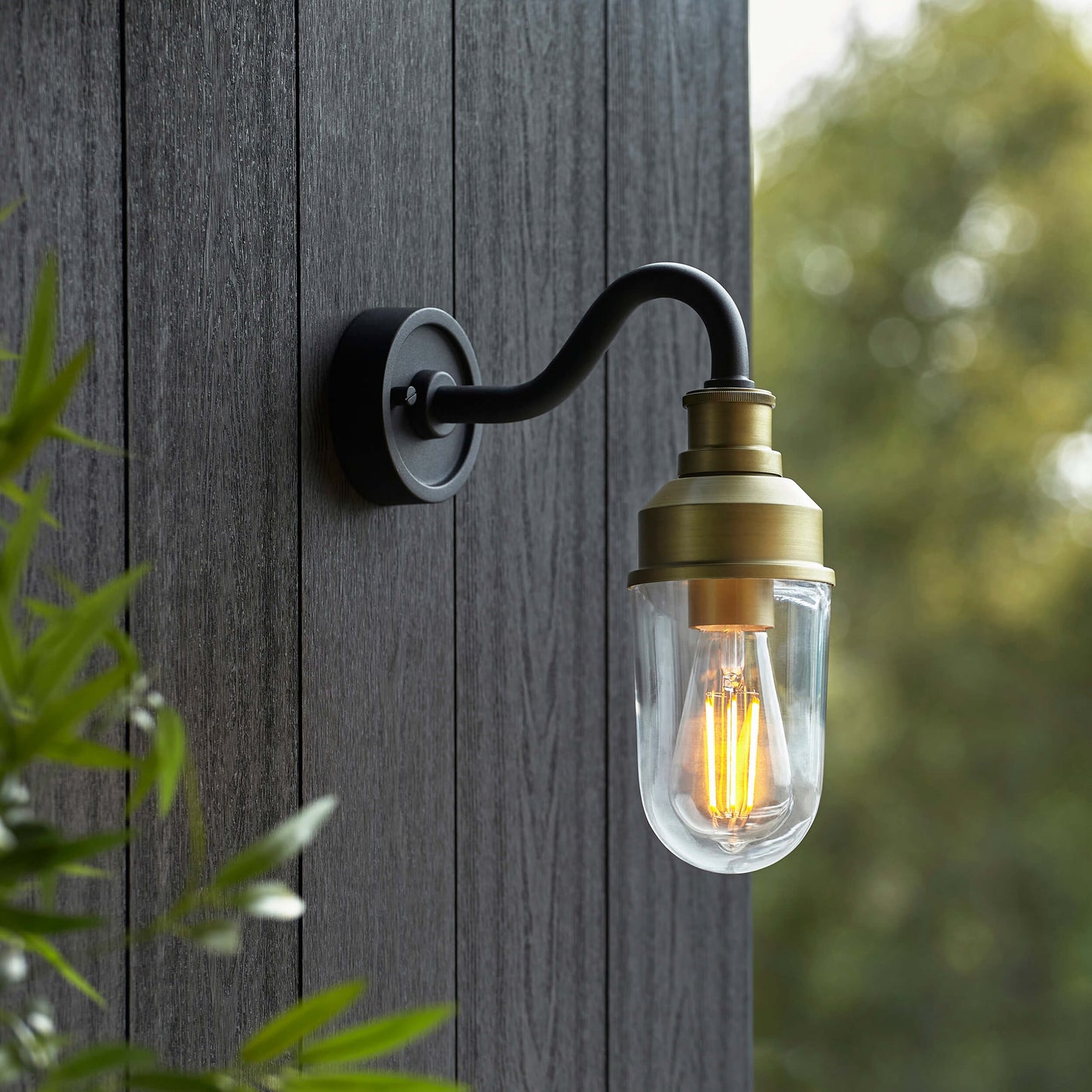 Matt Antique Brass Curved Arm Wall Light With Clear Glass - ID 12497