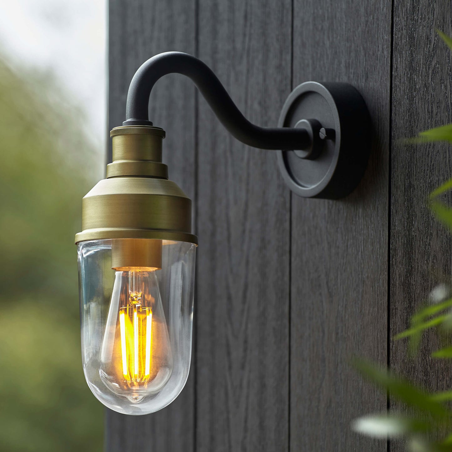 Matt Antique Brass Curved Arm Wall Light With Clear Glass - ID 12497