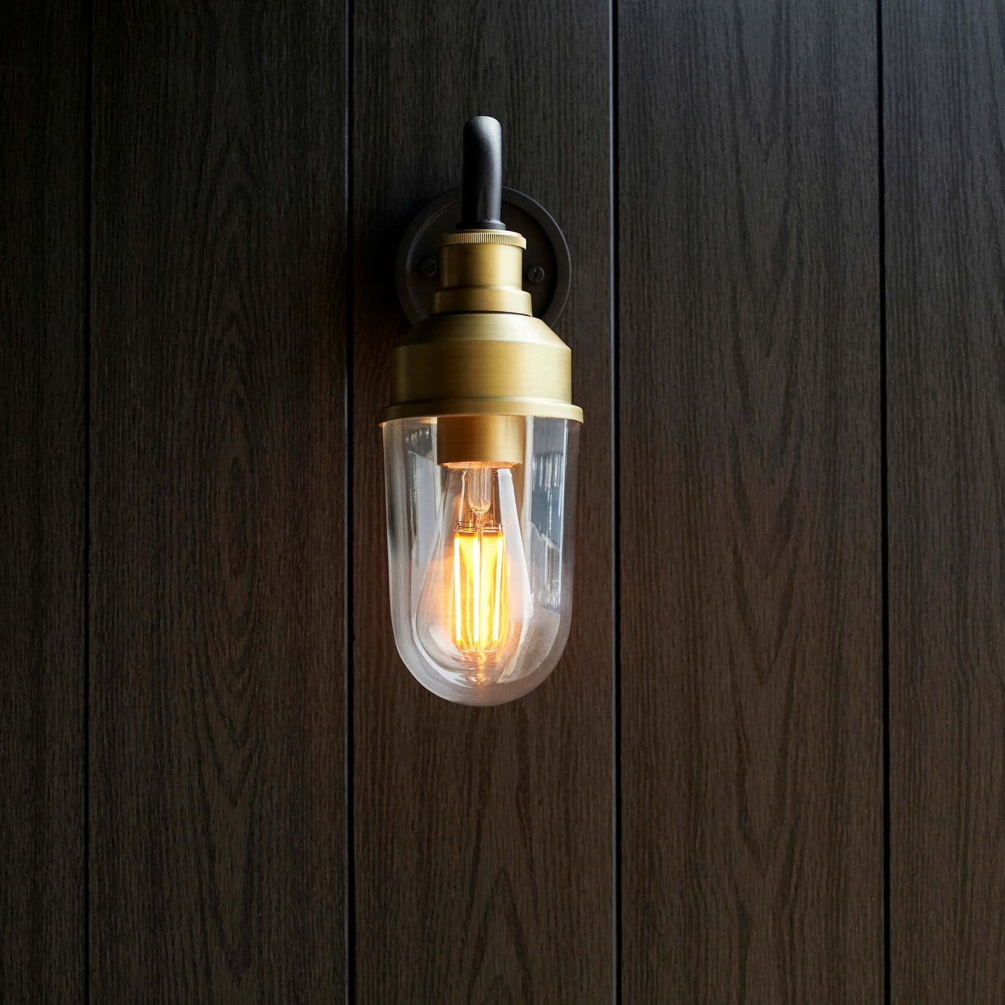 Matt Antique Brass Curved Arm Wall Light With Clear Glass - ID 12497