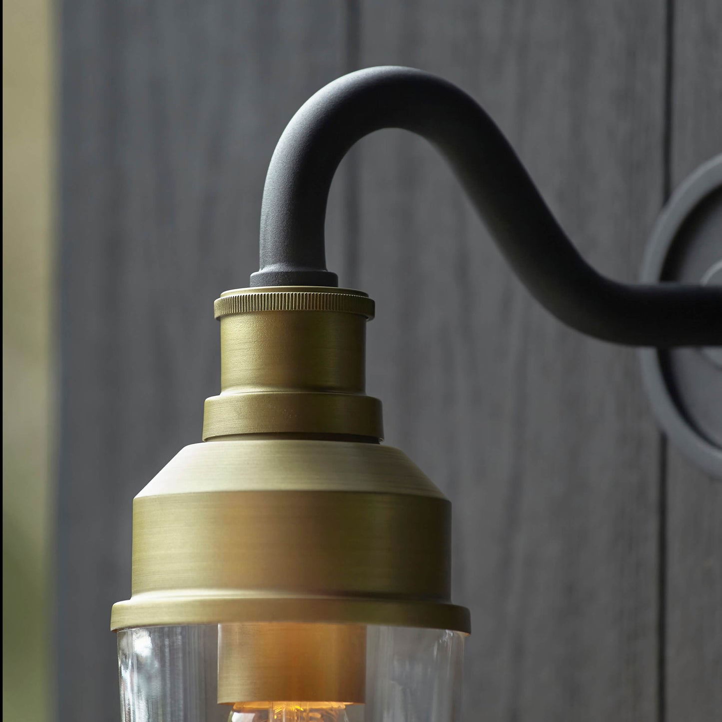 Matt Antique Brass Curved Arm Wall Light With Clear Glass - ID 12497